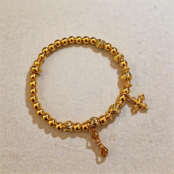 Traditional Gold-Dust Vajra Bracelet - Fortune and Prosperity, Round Beads with Four-Leaf Flower Bracelet